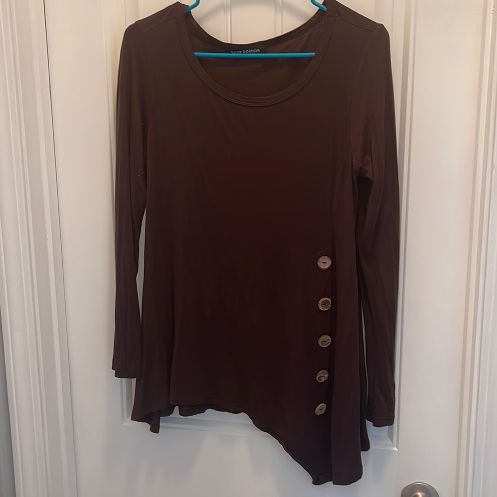 Long sleeve chocolate brown top with bottom down one side of the front.